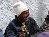 Mustang Lo Manthang Tiji Festival Day 1 02 Man Spinning Prayer Wheel The women sat on one side of the Lo Manthang square, while the men sat on the other. Here is a men spinning a prayer wheel.